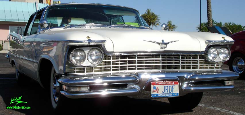Photo of a white 1957 Imperial 4 Door Hardtop Sedan at the Scottsdale Pavilions Classic Car Show in Arizona. 57 Imperial