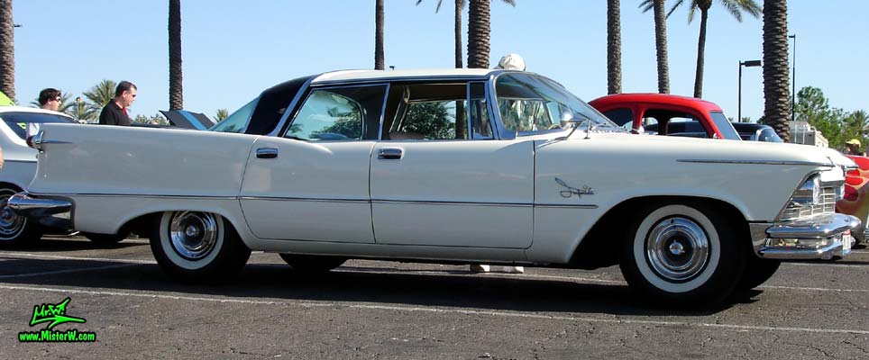 Photo of a white 1957 Imperial 4 Door Hardtop Sedan at the Scottsdale Pavilions Classic Car Show in Arizona. 57 Imperial 4 Door Hardtop