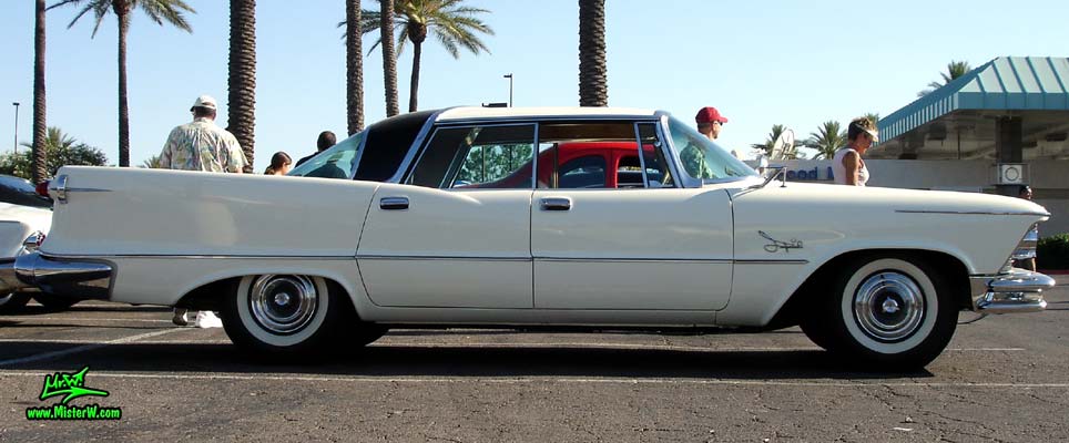 Photo of a white 1957 Imperial 4 Door Hardtop Sedan at the Scottsdale Pavilions Classic Car Show in Arizona. Sideview of a 57 Imperial