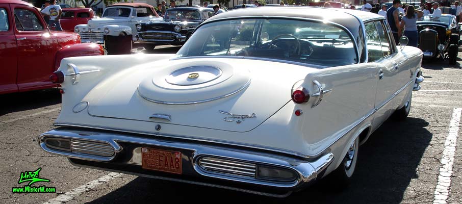 Photo of a white 1957 Imperial 4 Door Hardtop Sedan at the Scottsdale Pavilions Classic Car Show in Arizona. Tailfins of a 57 Imperial Sedan
