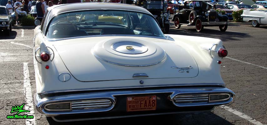 Photo of a white 1957 Imperial 4 Door Hardtop Sedan at the Scottsdale Pavilions Classic Car Show in Arizona. Rear & Fins of a 57 Imperial