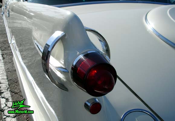 Photo of a white 1957 Imperial 4 Door Hardtop Sedan at the Scottsdale Pavilions Classic Car Show in Arizona. 1957 Imperial Tailfin & Rear Light