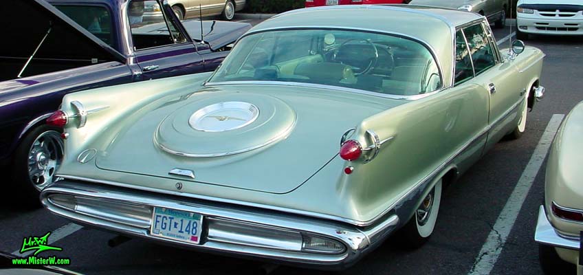 Photo of a turquoise 1959 Imperial 2 Door Hardtop Coupe at the Scottsdale Pavilions Classic Car Show in Arizona. 1959 Imperial Coupe Sideview