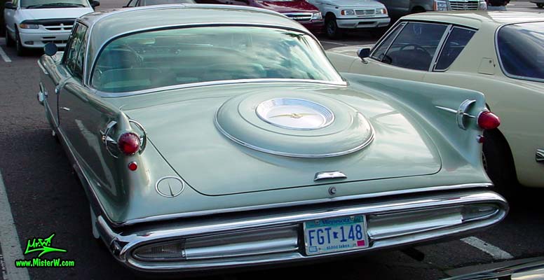 Photo of a turquoise 1959 Imperial 2 Door Hardtop Coupe at the Scottsdale Pavilions Classic Car Show in Arizona. 1959 Imperial Coupe Rearview
