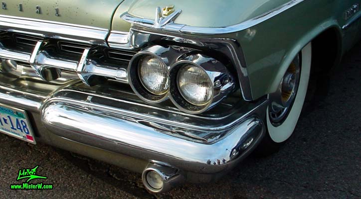 Photo of a turquoise 1959 Imperial 2 Door Hardtop Coupe at the Scottsdale Pavilions Classic Car Show in Arizona. 1959 Imperial Head Lights