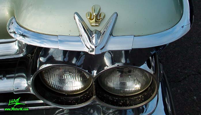 Photo of a turquoise 1959 Imperial 2 Door Hardtop Coupe at the Scottsdale Pavilions Classic Car Show in Arizona. 1959 Imperial Headlight Chrome