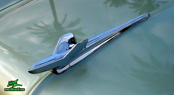 Photo of a turquoise 1959 Imperial 2 Door Hardtop Coupe at the Scottsdale Pavilions Classic Car Show in Arizona. 1959 Imperial Hood Ornament