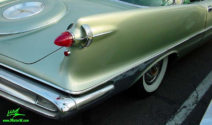 Photo of a turquoise 1959 Imperial 2 Door Hardtop Coupe at the Scottsdale Pavilions Classic Car Show in Arizona. 1959 Imperial Tail Fin