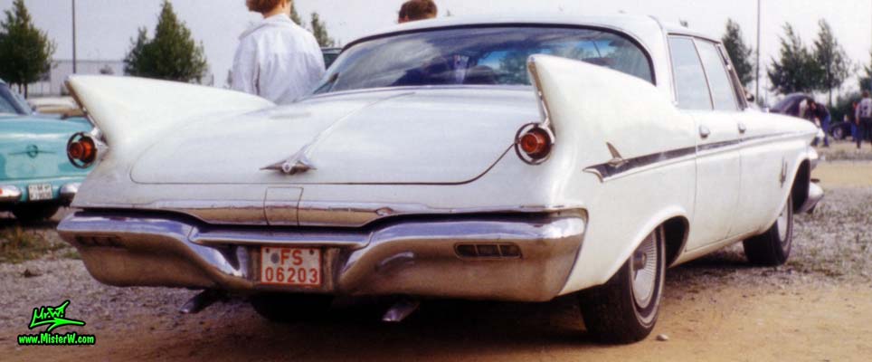 Photo of a white 1961 Imperial 4 Door Hardtop Sedan at a classic car meeting in Germany. 61 Imperial 4 Door Rearview