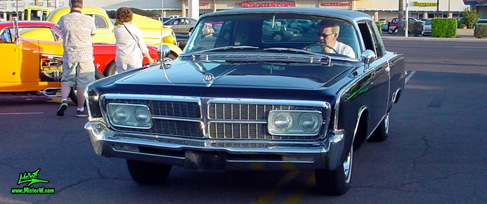Photo of a black 1965 Imperial 2 Door Hardtop Coupe at a classic car meeting in Phoenix, Arizona. 1965 Imperial Coupe Frontview