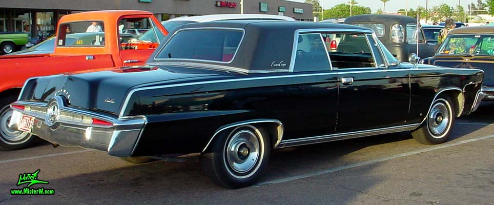 Photo of a black 1965 Imperial 2 Door Hardtop Coupe at a classic car meeting in Phoenix, Arizona. 65 Imperial