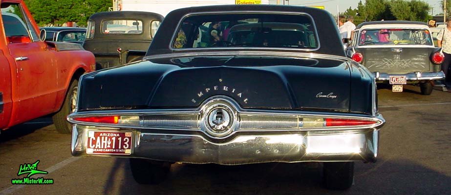 Photo of a black 1965 Imperial 2 Door Hardtop Coupe at a classic car meeting in Phoenix, Arizona. 1965 Imperial Coupe Rearview