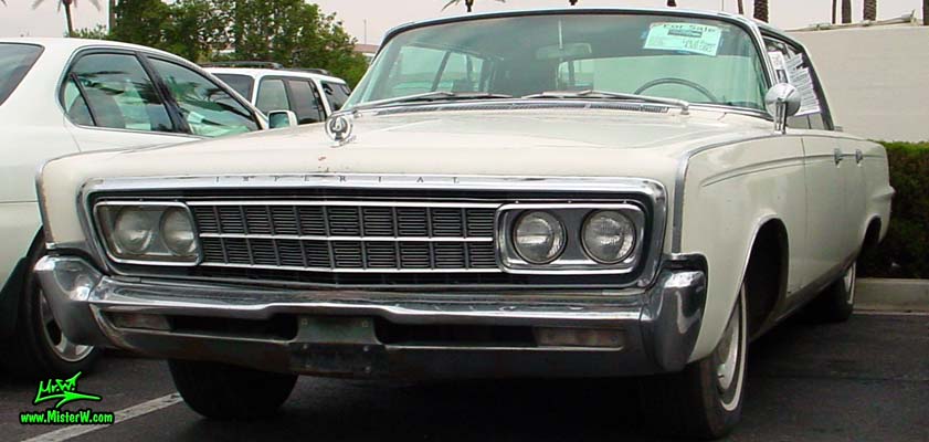 Photo of a white 1966 Imperial LeBaron 4 Door Hardtop Sedan at the Scottsdale Pavilions Classic Car Show in Arizona. 66 Imperial LeBaron