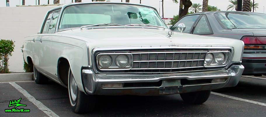 Photo of a white 1966 Imperial LeBaron 4 Door Hardtop Sedan at the Scottsdale Pavilions Classic Car Show in Arizona. 1966 Imperial LeBaron Sedan Sideview