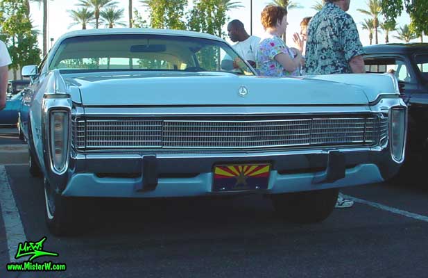 Photo of a blue 1973 Imperial 4 Door Hardtop Sedan at the Scottsdale Pavilions Classic Car Show in Arizona. 1973 Imperial Sedan with massive Chrome Grill & Bumper