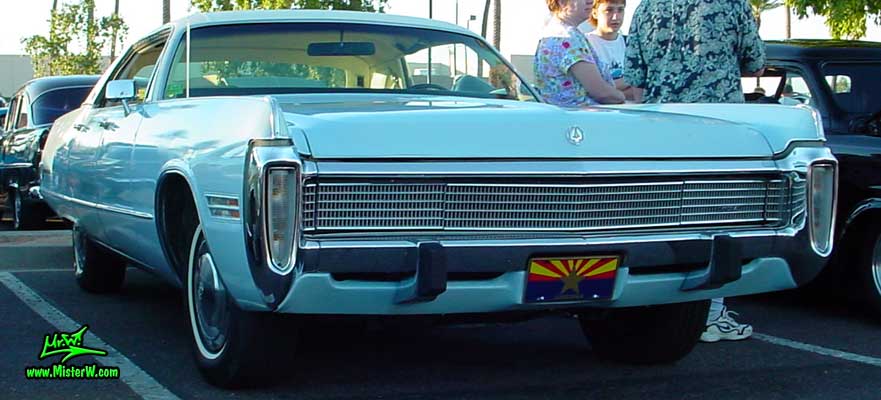 Photo of a blue 1973 Imperial 4 Door Hardtop Sedan at the Scottsdale Pavilions Classic Car Show in Arizona. 1973 Imperial Sedan with hidden Head Lights