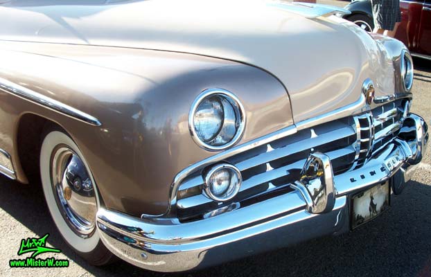 Photo of a tan 1949 Lincoln 9EL Series 4 door Sport Sedan with suicide doors at the Scottsdale Pavilions Classic Car Show in Arizona. Front view of a 1949 Lincoln 9EL Series Sport Sedan