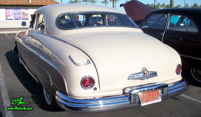 Photo of a tan 1949 Lincoln 9EL Series 4 door Sport Sedan with suicide doors at the Scottsdale Pavilions Classic Car Show in Arizona. Rear view of a 1949 Lincoln 9EL Series Sport Sedan