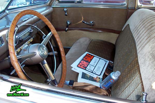 Photo of a tan 1949 Lincoln 9EL Series 4 door Sport Sedan with suicide doors at the Scottsdale Pavilions Classic Car Show in Arizona. Interior & dashboard of a 1949 Lincoln 9EL Series Sport Sedan