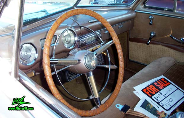 Photo of a tan 1949 Lincoln 9EL Series 4 door Sport Sedan with suicide doors at the Scottsdale Pavilions Classic Car Show in Arizona. Dash board & speedometer of a 1949 Lincoln 9EL Series Sport Sedan