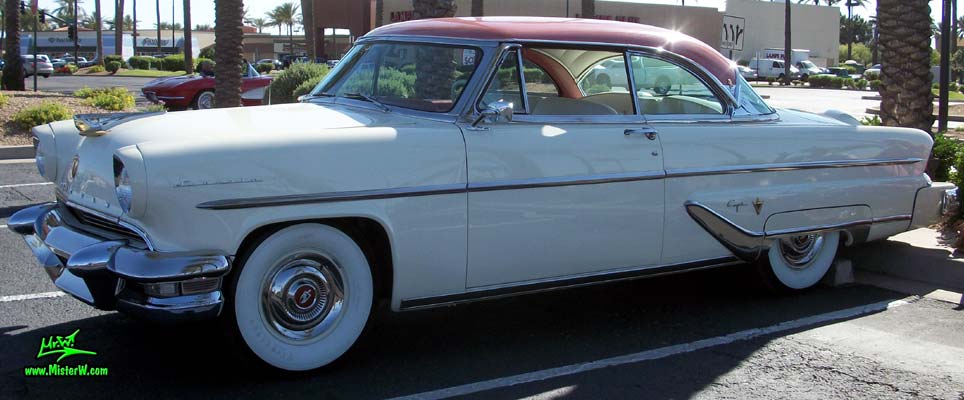 Photo of a white 1955 Lincoln Capri 2 door hardtop coupe at the Scottsdale Pavilions Classic Car Show in Arizona. 55 Lincoln Capri