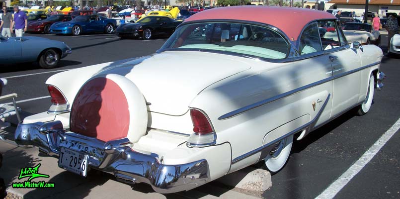 Photo of a white 1955 Lincoln Capri 2 door hardtop coupe at the Scottsdale Pavilions Classic Car Show in Arizona. Tailfins & continental kit of a 1955 Lincoln Capri hardtop coupe