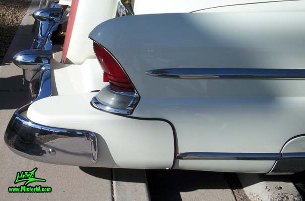 Photo of a white 1955 Lincoln Capri 2 door hardtop coupe at the Scottsdale Pavilions Classic Car Show in Arizona. Tail fin of a 1955 Lincoln Capri hardtop coupe