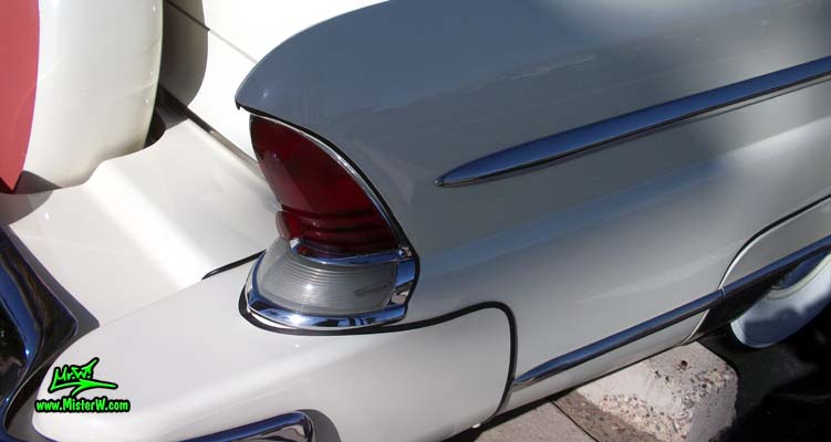 Photo of a white 1955 Lincoln Capri 2 door hardtop coupe at the Scottsdale Pavilions Classic Car Show in Arizona. Tail light & fin of a 1955 Lincoln Capri hardtop coupe