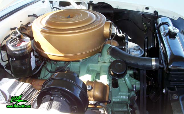 Photo of a white 1955 Lincoln Capri 2 door hardtop coupe at the Scottsdale Pavilions Classic Car Show in Arizona. Motor bay of a 1955 Lincoln Capri hardtop coupe