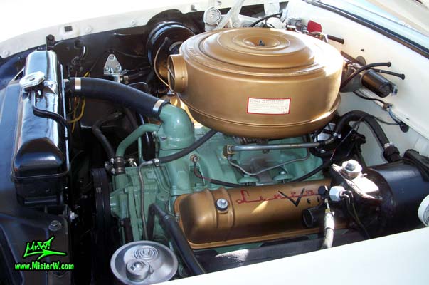 Photo of a white 1955 Lincoln Capri 2 door hardtop coupe at the Scottsdale Pavilions Classic Car Show in Arizona. Engine compartment of a 1955 Lincoln Capri hardtop coupe