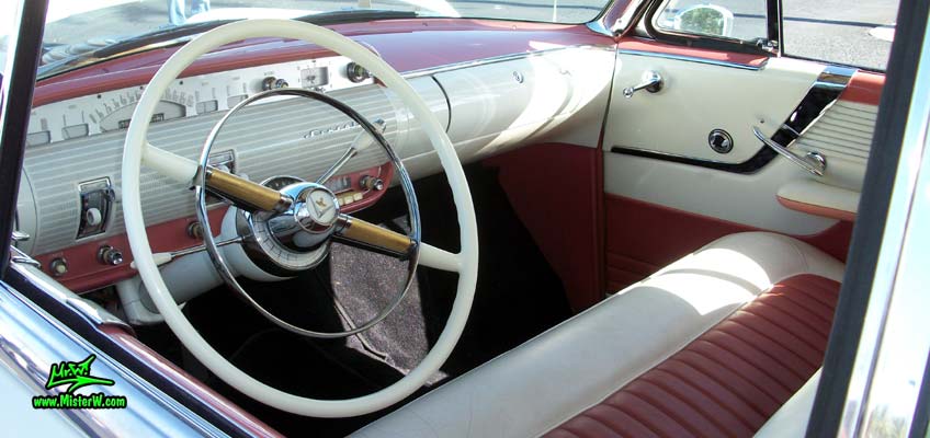 Photo of a white 1955 Lincoln Capri 2 door hardtop coupe at the Scottsdale Pavilions Classic Car Show in Arizona. Interior & dashboard of a 1955 Lincoln Capri hardtop coupe