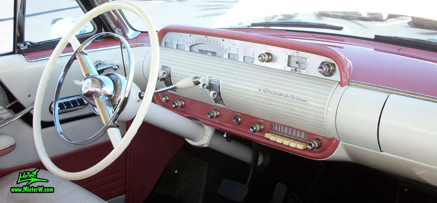 Photo of a white 1955 Lincoln Capri 2 door hardtop coupe at the Scottsdale Pavilions Classic Car Show in Arizona. Dash, odometer & speedometer of a 1955 Lincoln Capri hardtop coupe