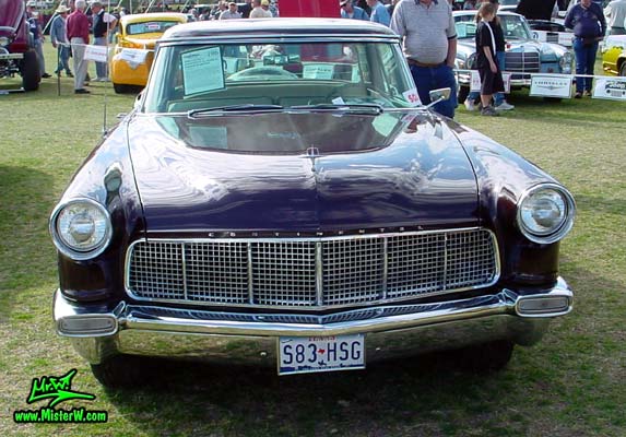 Photo of a purple 1956 Lincoln Continental Mark II 2 door hardtop coupe at a Classic Car Auction in Scottsdale, Arizona. Frontview of a 1956 Lincoln Continental Mark II
