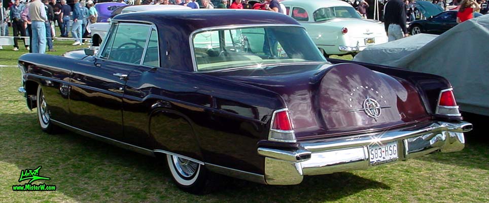 Photo of a purple 1956 Lincoln Continental Mark II 2 door hardtop coupe at a Classic Car Auction in Scottsdale, Arizona. Sideview of a 1956 Lincoln Continental Mark II