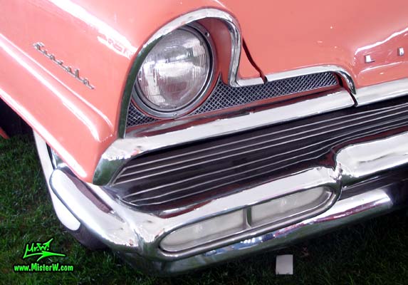 Photo of a pink 1956 Lincoln Premiere 2 door hardtop coupe at a Classic Car Auction in Scottsdale, Arizona. 1956 Lincoln Head Light