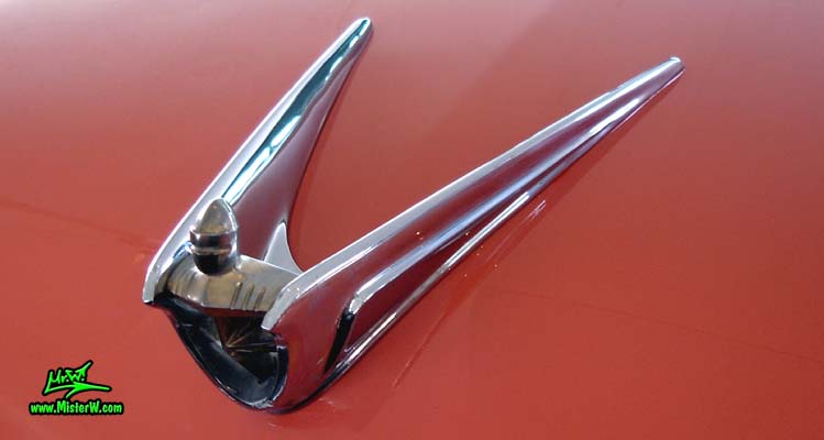 Photo of a pink 1956 Lincoln Premiere 2 door hardtop coupe at a Classic Car Auction in Scottsdale, Arizona. 1956 Lincoln Hood Chrome Mascot