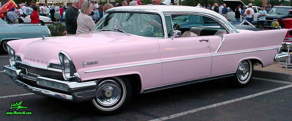 Photo of a pink & white 1957 Lincoln Premiere 2 door hardtop coupe at the Scottsdale Pavilions Classic Car Show in Arizona. 57 Lincoln Premiere