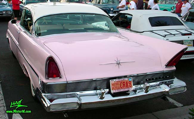 Photo of a pink & white 1957 Lincoln Premiere 2 door hardtop coupe at the Scottsdale Pavilions Classic Car Show in Arizona. Rear bumper of a 1957 Lincoln Premiere hardtop coupe