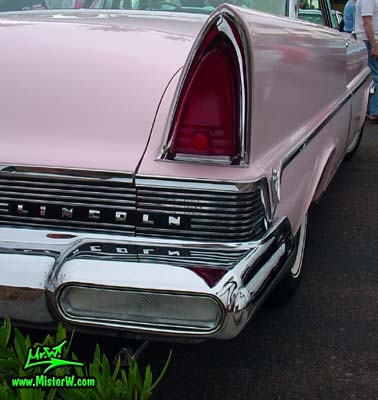 Photo of a pink & white 1957 Lincoln Premiere 2 door hardtop coupe at the Scottsdale Pavilions Classic Car Show in Arizona. Tail light & chrome trim of a 1957 Lincoln Premiere hardtop coupe