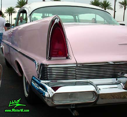 Photo of a pink & white 1957 Lincoln Premiere 2 door hardtop coupe at the Scottsdale Pavilions Classic Car Show in Arizona. Tail light & fin of a 1957 Lincoln Premiere hardtop coupe
