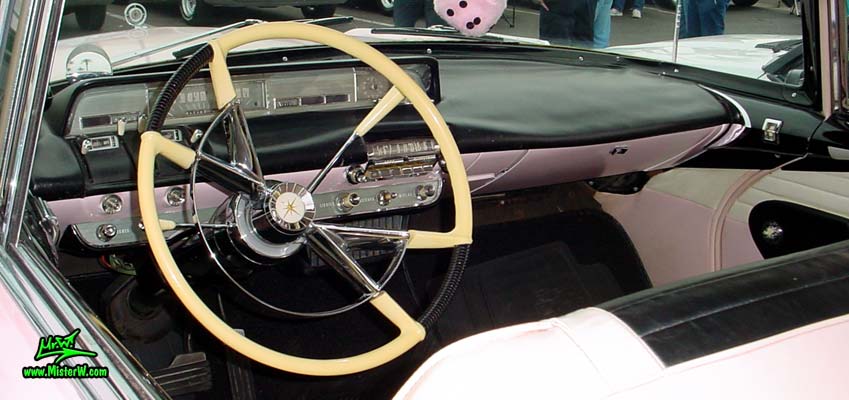 Photo of a pink & white 1957 Lincoln Premiere 2 door hardtop coupe at the Scottsdale Pavilions Classic Car Show in Arizona. Dash board & speedometer of a 1957 Lincoln Premiere hardtop coupe