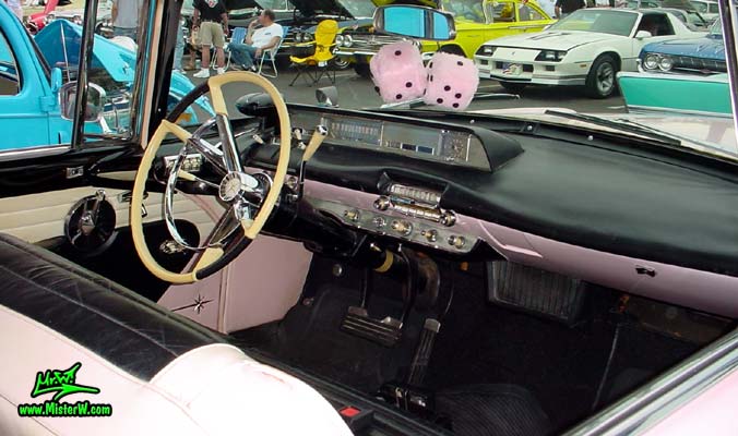 Photo of a pink & white 1957 Lincoln Premiere 2 door hardtop coupe at the Scottsdale Pavilions Classic Car Show in Arizona. Interior & dashboard of a 1957 Lincoln Premiere hardtop coupe