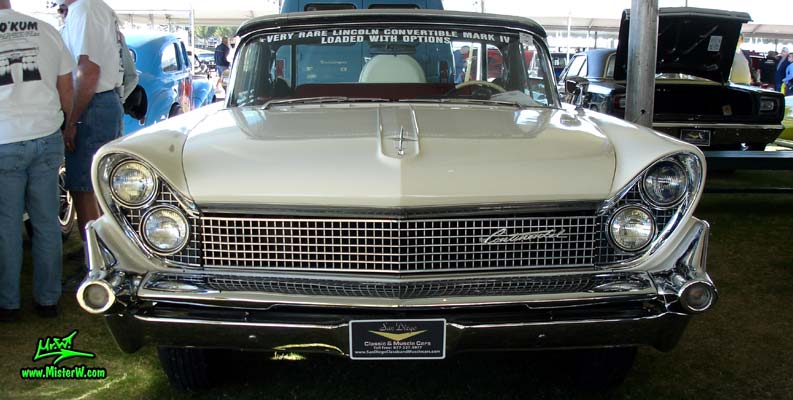 Photo of a white 1959 Lincoln Continental Mark IV convertible at a Classic Car Auction in Scottsdale, Arizona. Front view of a 1959 Lincoln Continental Mark IV Convertible