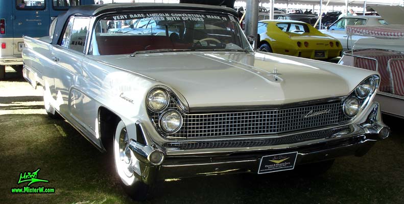 Photo of a white 1959 Lincoln Continental Mark IV convertible at a Classic Car Auction in Scottsdale, Arizona. Front chrome grill of a 1959 Lincoln Continental Mark IV Convertible
