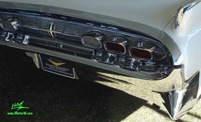 Photo of a white 1959 Lincoln Continental Mark IV convertible at a Classic Car Auction in Scottsdale, Arizona. Tail lights of a 1959 Lincoln Continental Mark IV Convertible