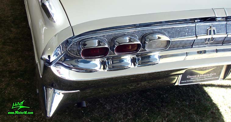 Photo of a white 1959 Lincoln Continental Mark IV convertible at a Classic Car Auction in Scottsdale, Arizona. Tail fin of a 1959 Lincoln Continental Mark IV Convertible