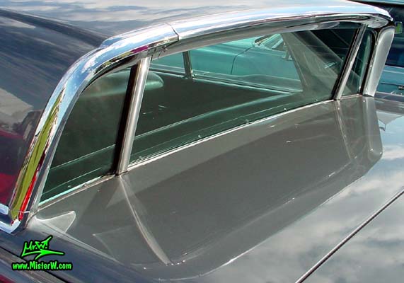 Photo of a silver gray metallic 1960 Lincoln Continental Mark V 2 door hardtop coupe at a Classic Car Auction in Scottsdale, Arizona. Electric rear window of a 1960 Lincoln Continental Mark V coupe