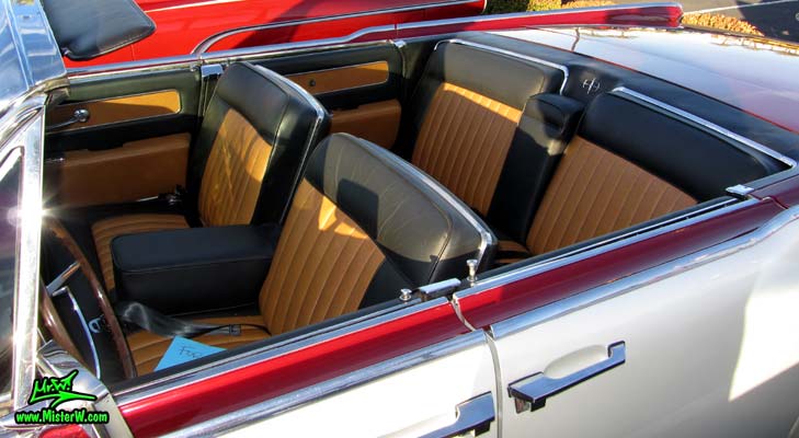 Photo of a red & white 1961 Lincoln Continental 4 door convertible at the Scottsdale Pavilions Classic Car Show in Arizona. Interior of a 1961 Lincoln Continental convertible