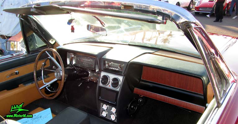 Photo of a red & white 1961 Lincoln Continental 4 door convertible at the Scottsdale Pavilions Classic Car Show in Arizona. Dashboard & interior of a 1961 Lincoln Continental convertible
