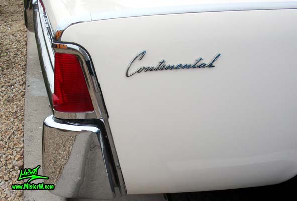 Photo of a white 1962 Lincoln Continental 4 door convertible at the Scottsdale Pavilions Classic Car Show in Arizona. Tail light of a 1962 Lincoln Continental convertible